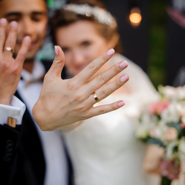 Bride and Groom showing their wedding rings to their Michigan Wedding DJ